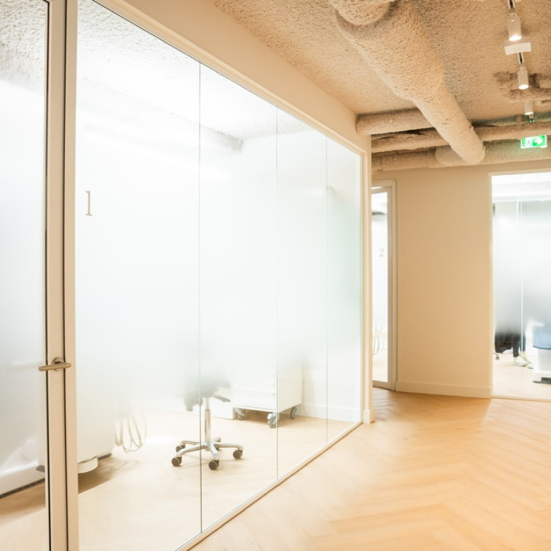 Treatment room 1 behind a glass wall with a sprayed-concrete ceiling
