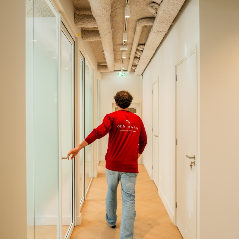 Den Haan Renovators team member in the corridor of the dental practice